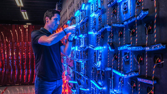 Hamza Dayef works on a wall of LED lights